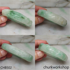 Carved light green jade bangle