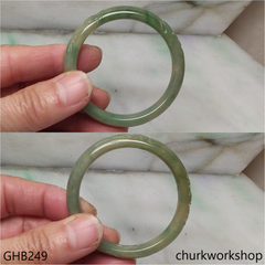 Small carved bluish green jade bangle