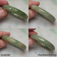 Small carved bluish green jade bangle